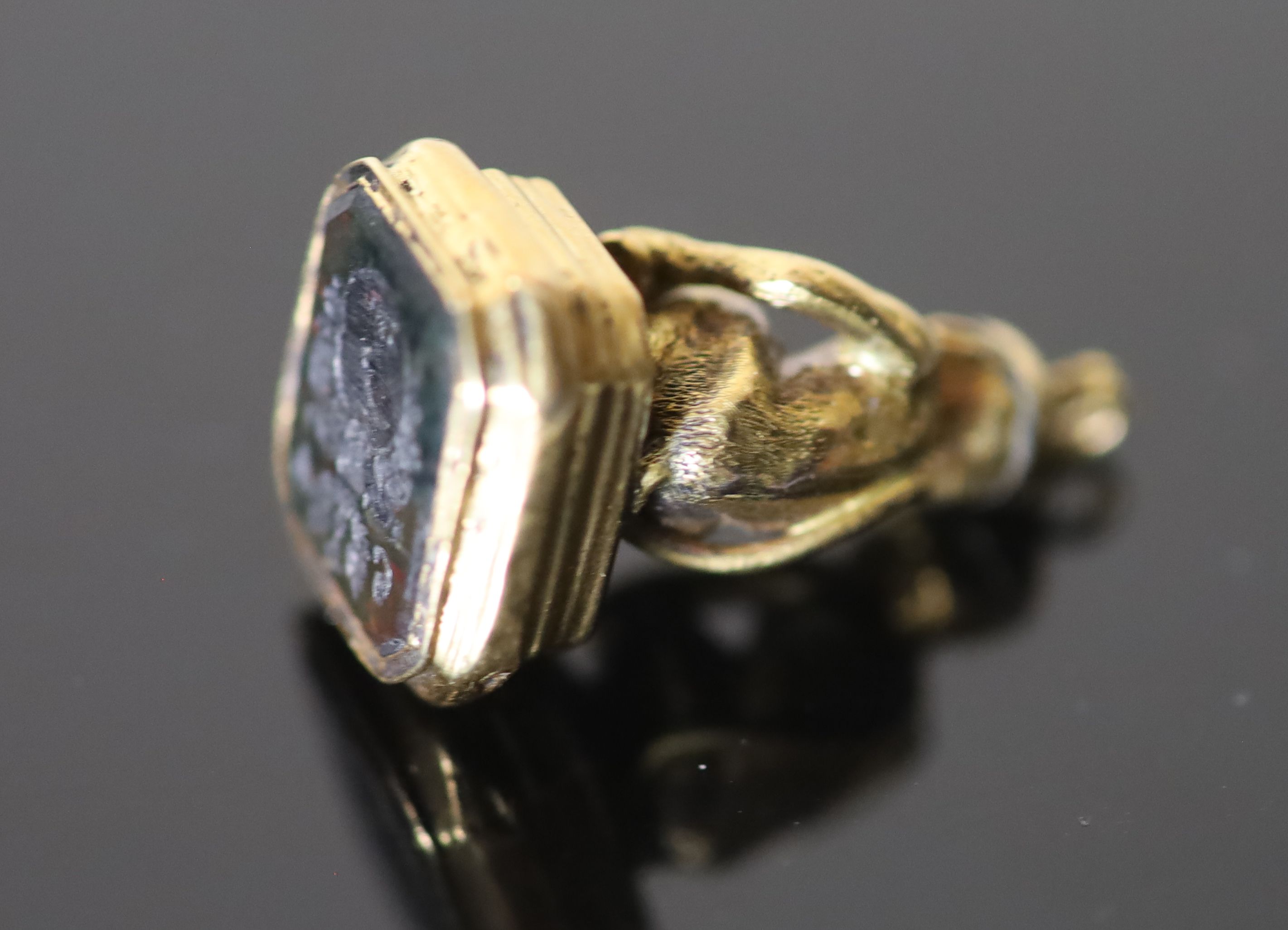 A 19th century gold and black onyx? set seal,